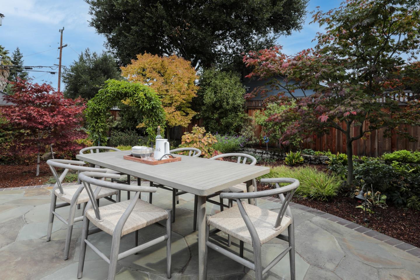 732 Laurel Avenue Menlo Park, CA 94025 - Photo 17 of 22 a patio with table and chairs and potted plants