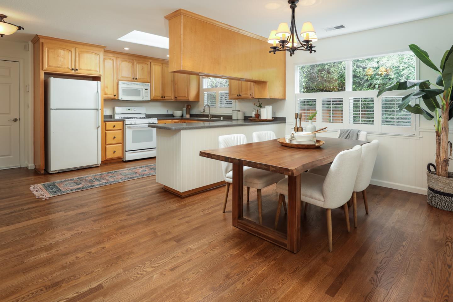 732 Laurel Avenue Menlo Park, CA 94025 - Photo 5 of 22 a kitchen with stainless steel appliances granite countertop a table chairs refrigerator and a sink