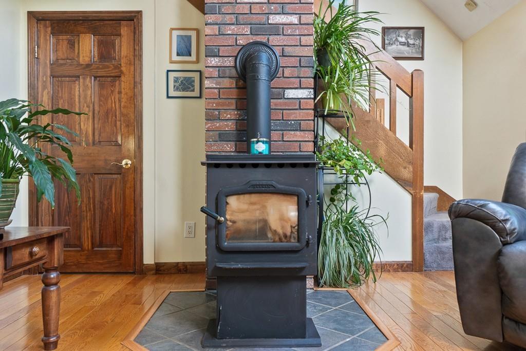 63 Russell Hill Road Ashburnham, MA 01430 - Photo 11 of 30 a living room with furniture and a fireplace