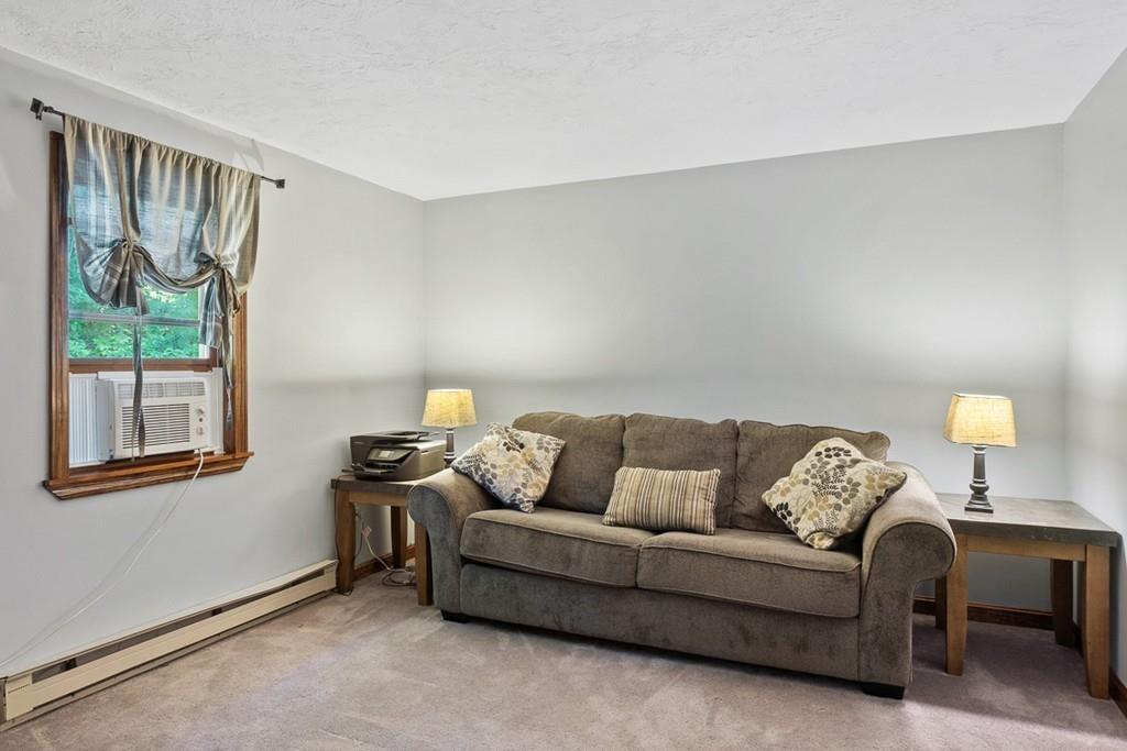 63 Russell Hill Road Ashburnham, MA 01430 - Photo 13 of 30 a living room with furniture and a window