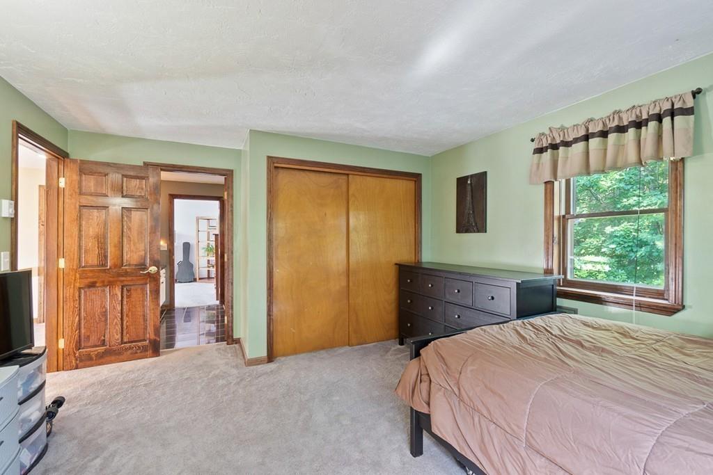 63 Russell Hill Road Ashburnham, MA 01430 - Photo 24 of 30 a bedroom with a bed and a large window