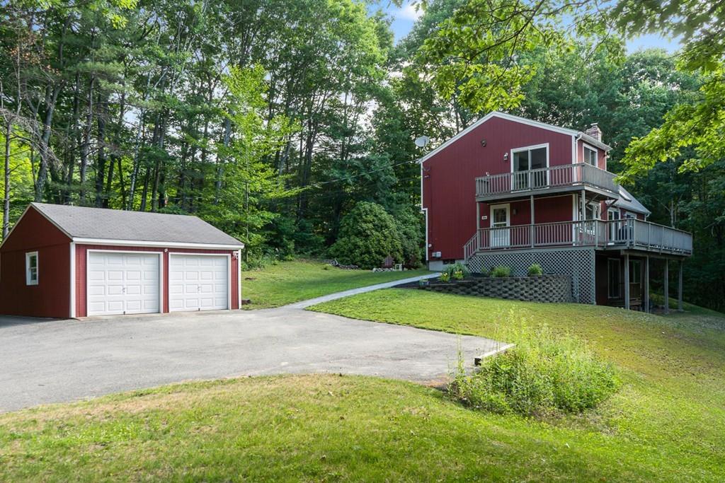 63 Russell Hill Road Ashburnham, MA 01430 - Photo 27 of 30 a front view of a house with yard and green space