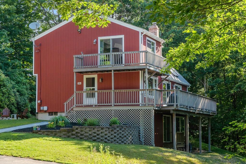 63 Russell Hill Road Ashburnham, MA 01430 - Photo 3 of 30 a view of a house with a yard plants and large tree