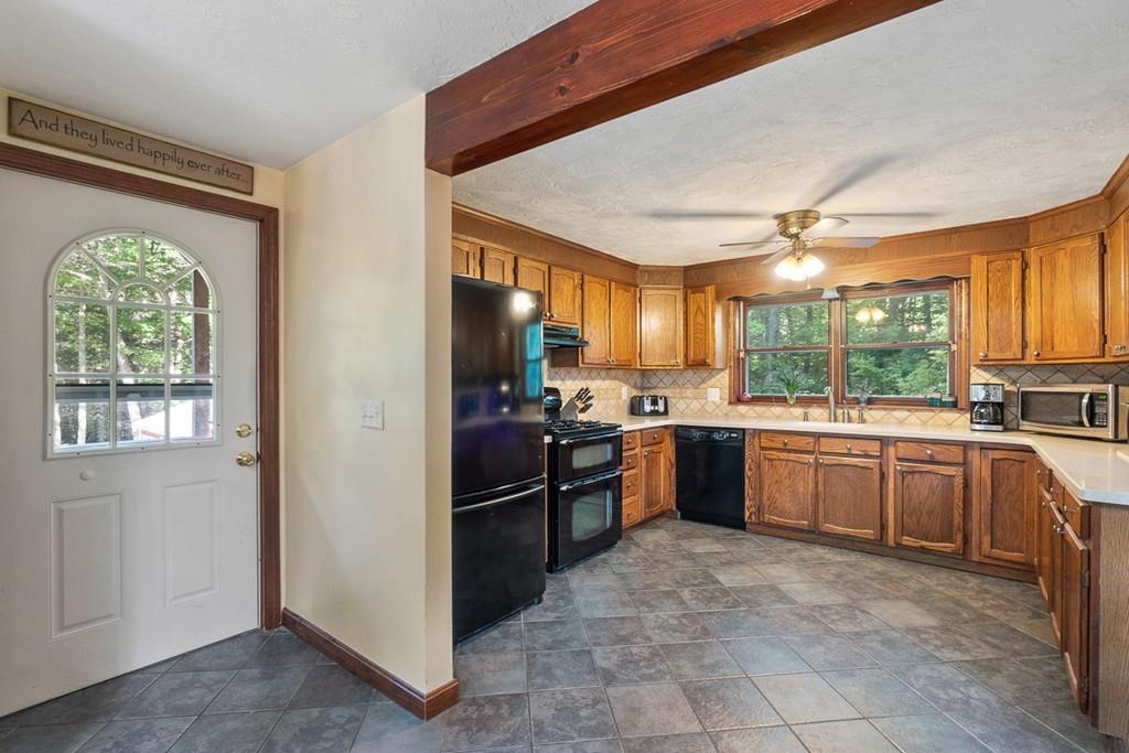 63 Russell Hill Road Ashburnham, MA 01430 - Photo 5 of 30 a kitchen with stainless steel appliances granite countertop a refrigerator a sink a stove and oven