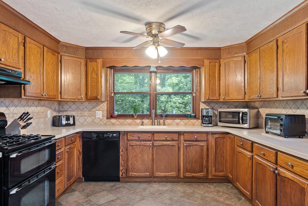 63 Russell Hill Road Ashburnham, MA 01430 - Photo 7 of 30 a kitchen with a sink stove top oven and cabinets