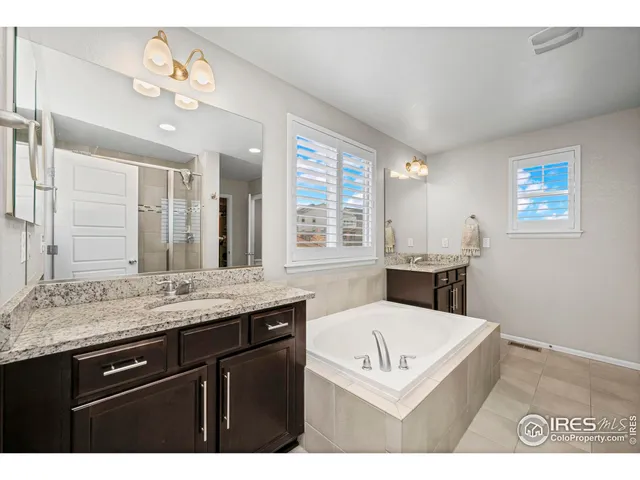 a living room with stainless steel appliances kitchen island granite countertop furniture and a large window