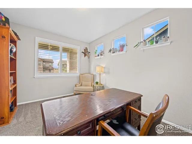 a view of a workspace with furniture