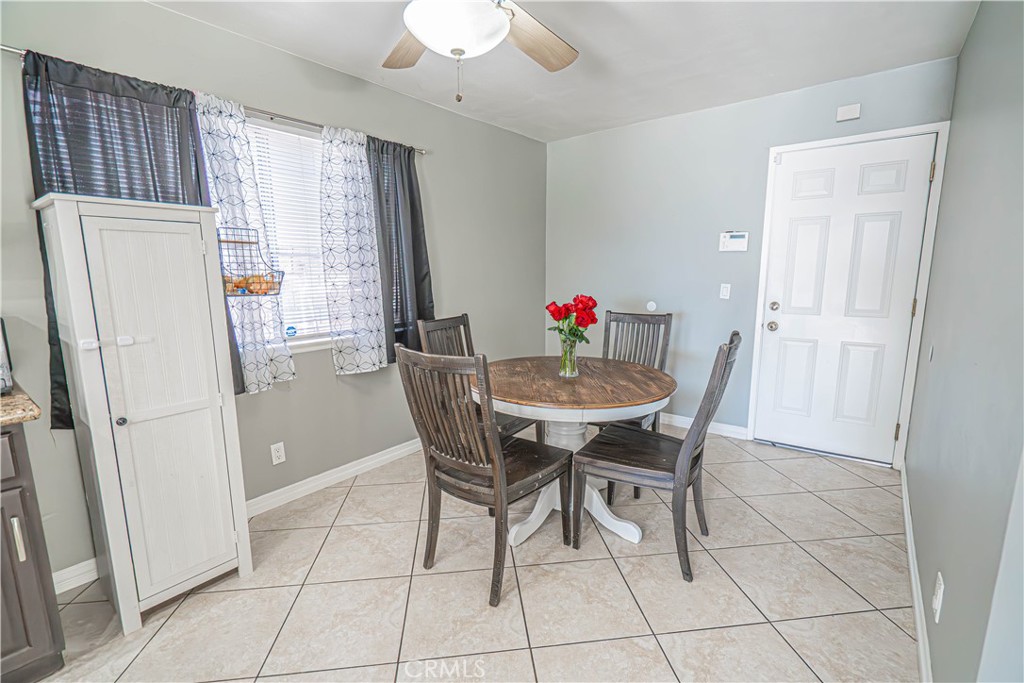 28076 Wildwind Road Canyon Country, CA 91351 - Photo 14 of 48 a dining room with furniture and window