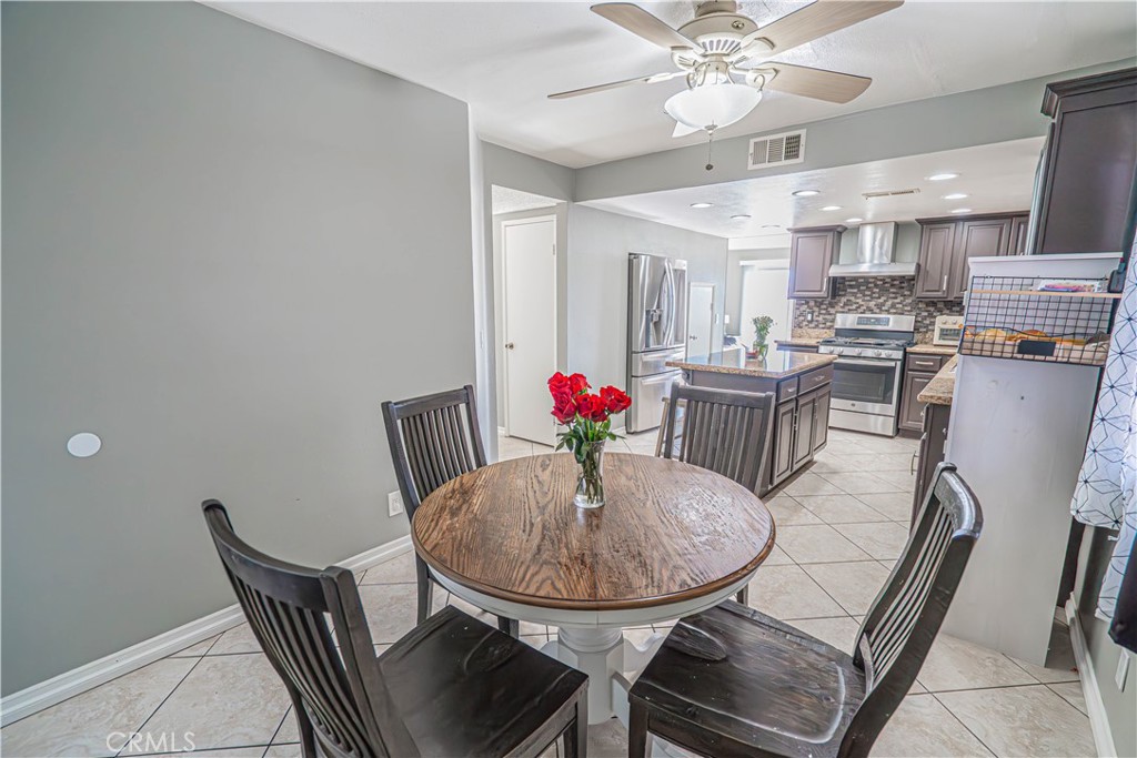 28076 Wildwind Road Canyon Country, CA 91351 - Photo 15 of 48 a view of a dining room with furniture
