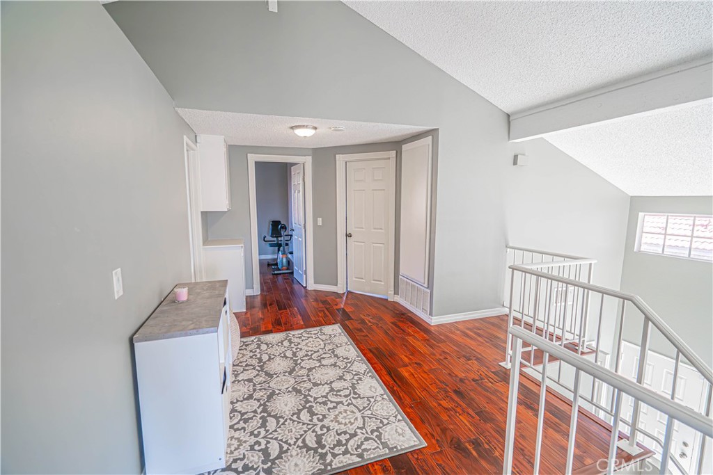 28076 Wildwind Road Canyon Country, CA 91351 - Photo 20 of 48 a bedroom with wooden floor and furniture
