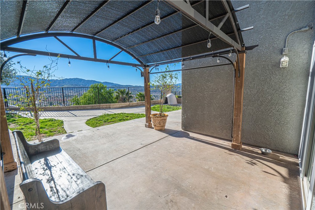 28076 Wildwind Road Canyon Country, CA 91351 - Photo 32 of 48 a view of a porch with furniture and a yard