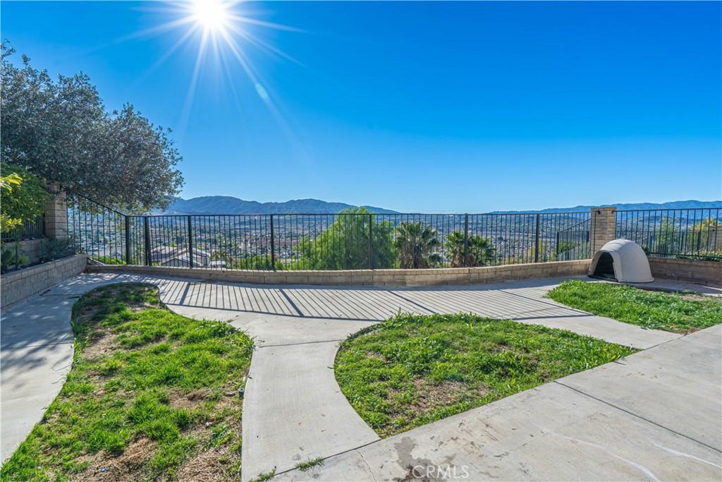 28076 Wildwind Road Canyon Country, CA 91351 - Photo 34 of 48 a view of a garden with a patio