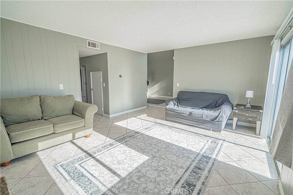 28076 Wildwind Road Canyon Country, CA 91351 - Photo 10 of 48 a living room with a couch and a coffee table