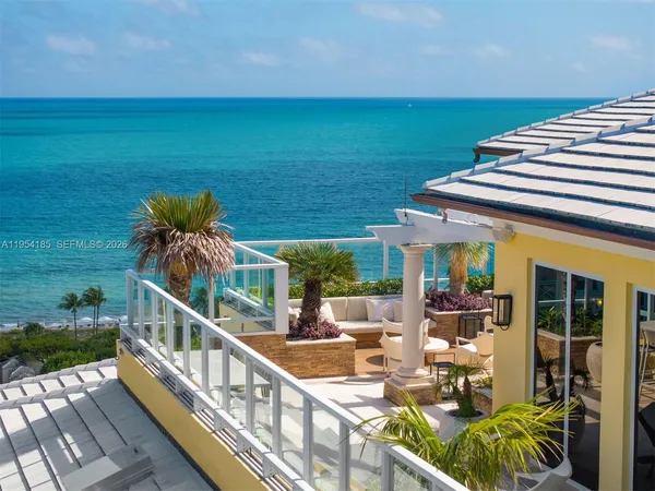 a view of a house with backyard and patio