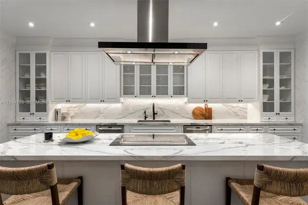 a kitchen with stainless steel appliances granite countertop a sink and a cabinets