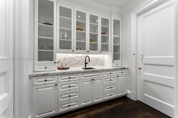 a kitchen with cabinets and window