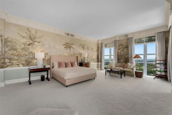 a spacious bedroom with a bed and a couch