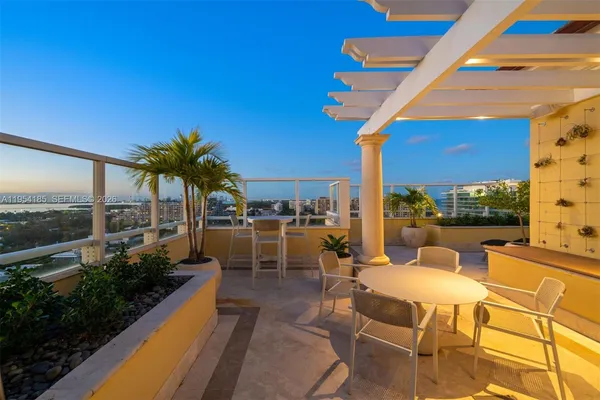 a view of a patio with swimming pool