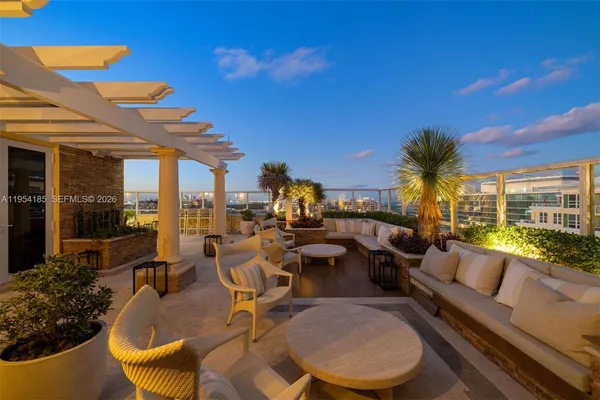 a view of a balcony with wooden floor and city view