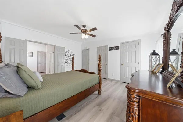 a bed room with a bed and a chandelier