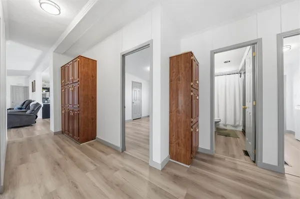 a view of a livingroom with wooden floor and closet