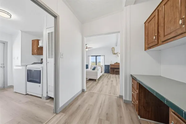 a kitchen with a stove and a refrigerator