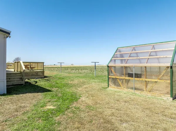 a view of a balcony with wooden floor