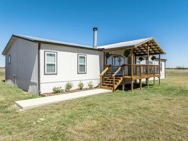 a view of roof deck with seating area