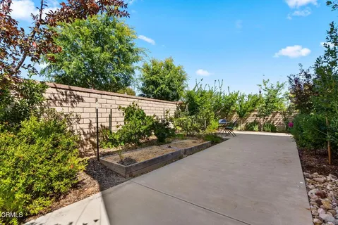 a large kitchen with stainless steel appliances kitchen island granite countertop a large counter top a stove a sink dishwasher a dining table and chairs