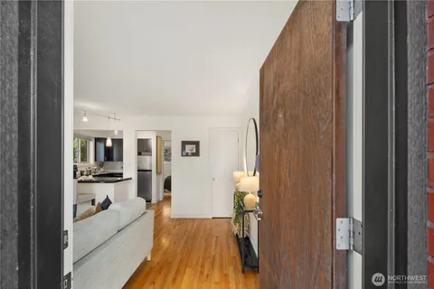 a view of a bathroom with tub and door