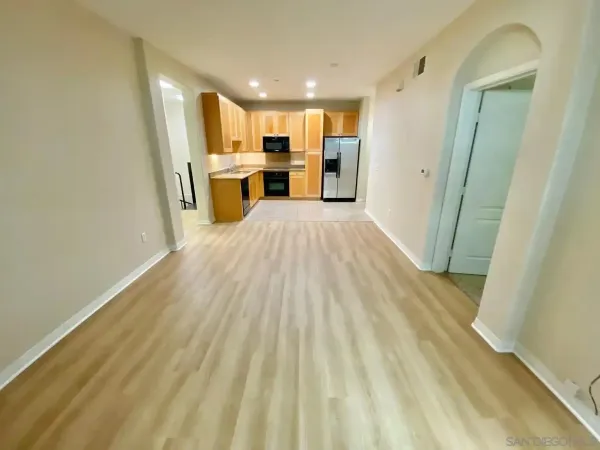 a view of kitchen view with wooden floor and electronic appliances