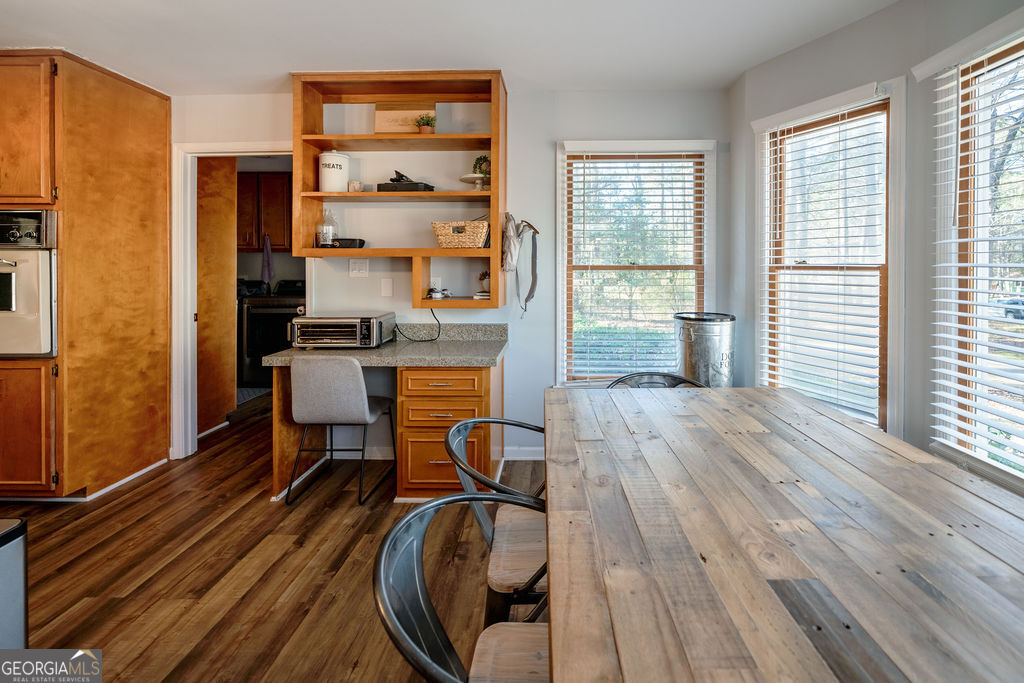 115 Devilla Trace Fayetteville, GA 30214 - Photo 11 of 30 a view of a workspace with furniture and wooden floor