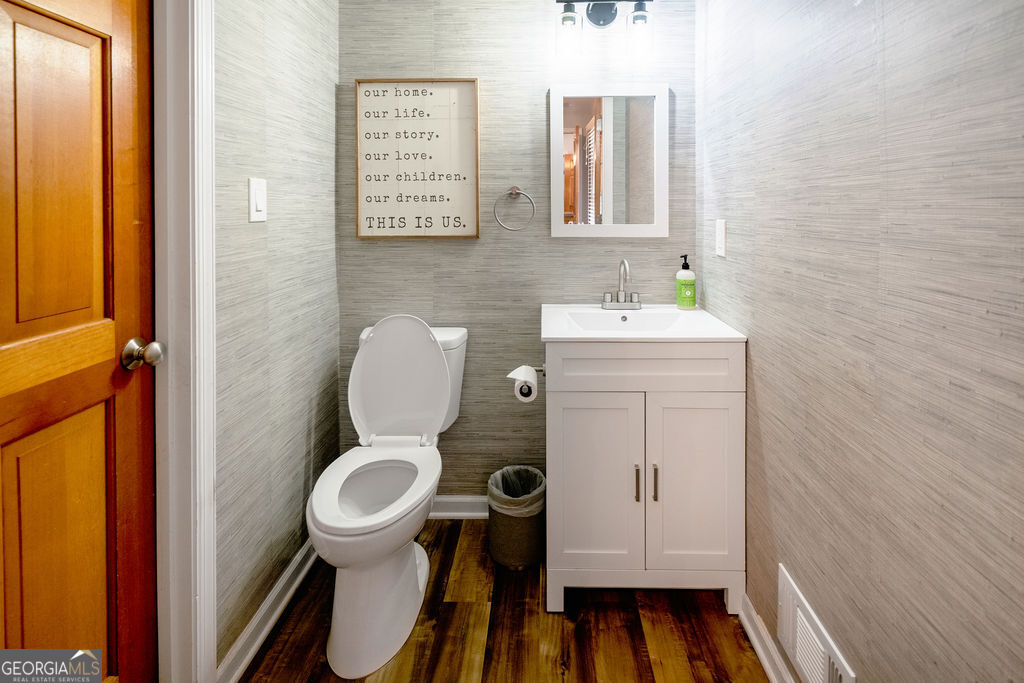 115 Devilla Trace Fayetteville, GA 30214 - Photo 13 of 30 a bathroom with a toilet and a sink