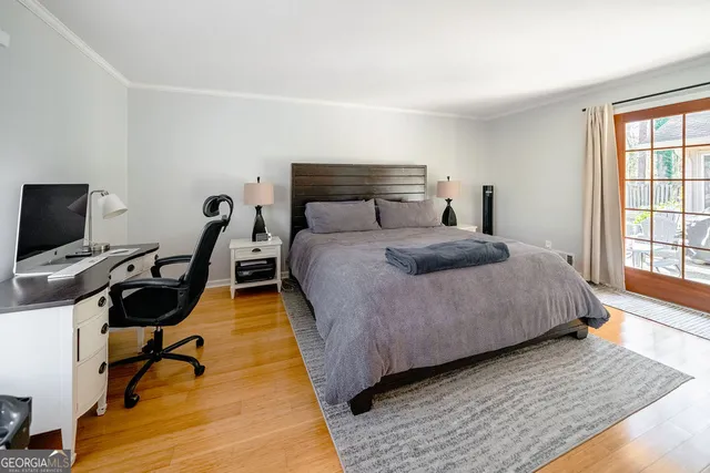 a bedroom with a bed a desk and chair