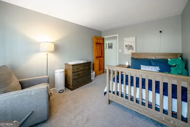 a bedroom with furniture and a window