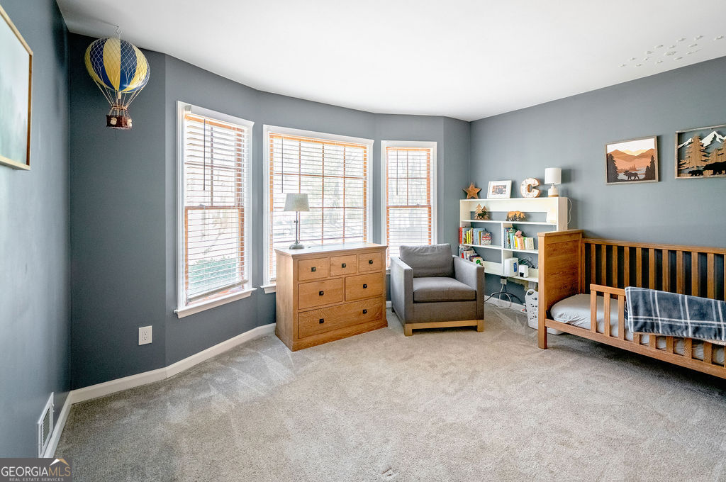 115 Devilla Trace Fayetteville, GA 30214 - Photo 21 of 30 a bedroom with furniture and a window
