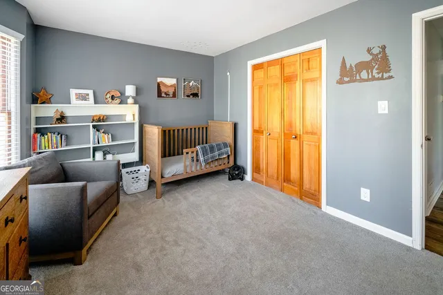 a bed room with a bed and a window