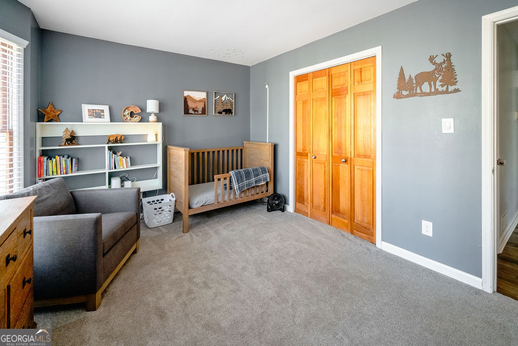 115 Devilla Trace Fayetteville, GA 30214 - Photo 22 of 30 a bed room with a bed and a window