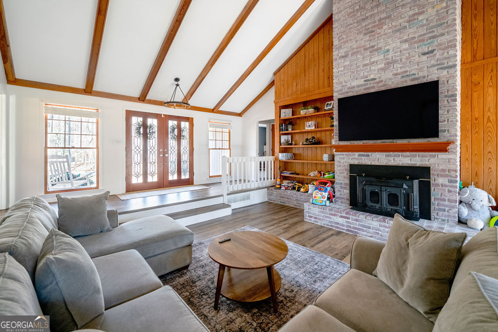115 Devilla Trace Fayetteville, GA 30214 - Photo 7 of 30 a living room with furniture large window and a fireplace
