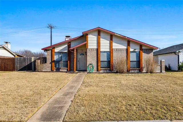 a front view of the house with a yard