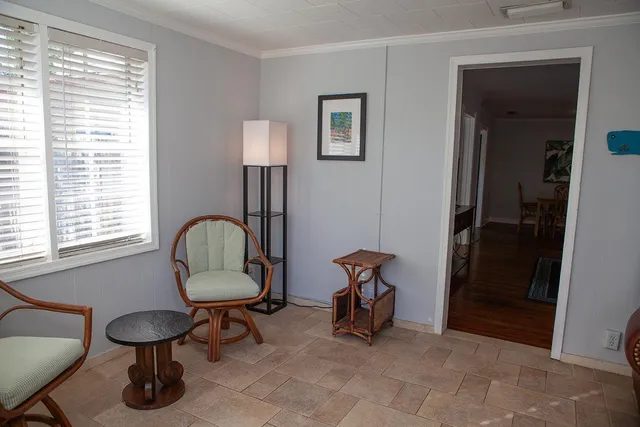a view of a livingroom with furniture and a window