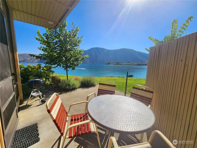a view of a chairs and table in patio