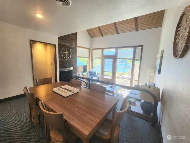 a view of a dining room with furniture window and outside view