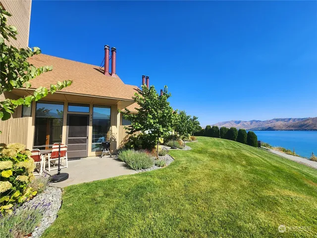 a view of a swimming pool with an outdoor space and seating area