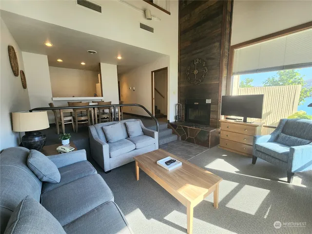 a living room with furniture and a table