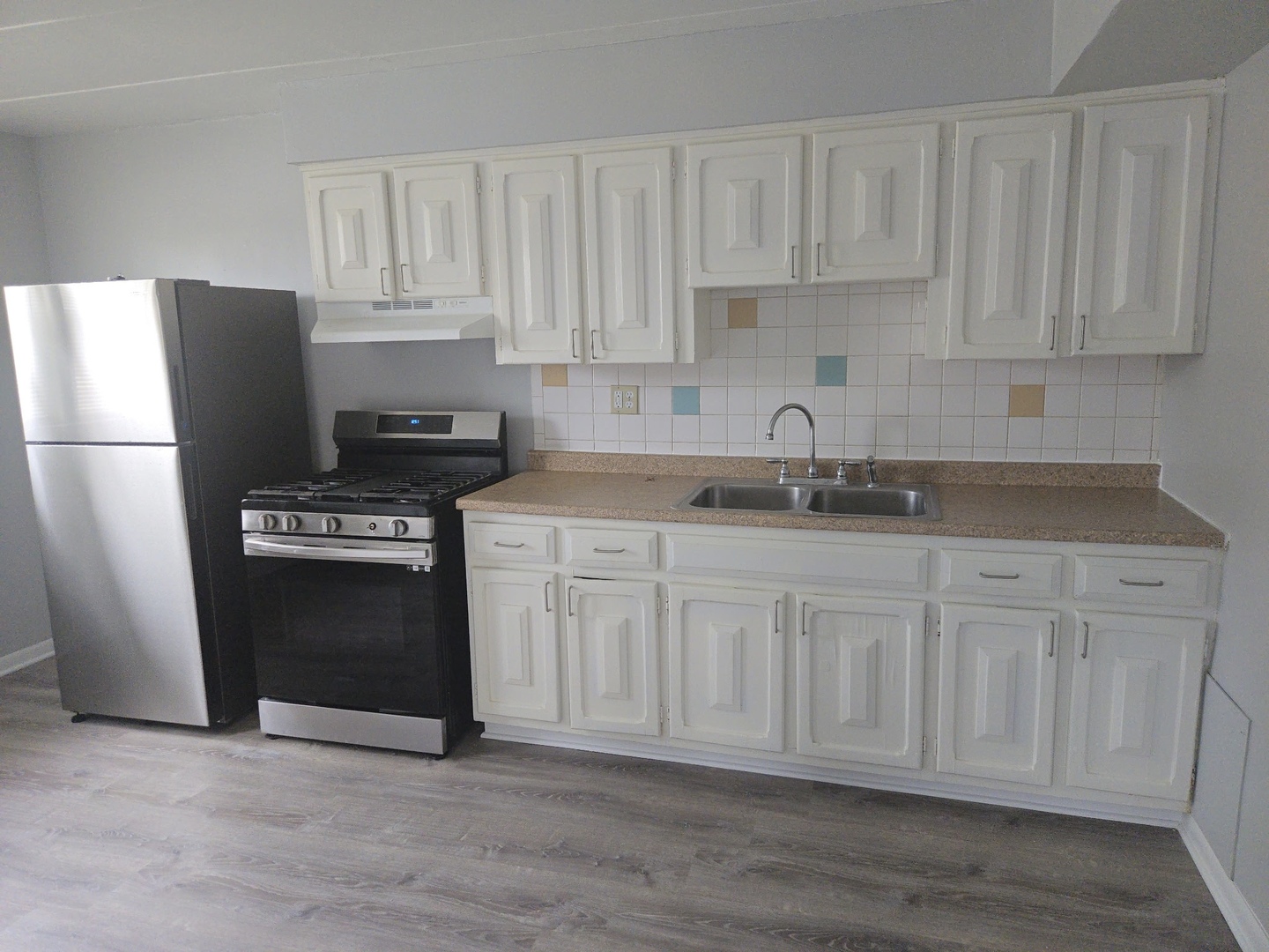 446 North Ardmore Avenue, Unit GB Villa Park, IL 60181 - Photo 4 of 9 a kitchen with granite countertop white cabinets and stainless steel appliances