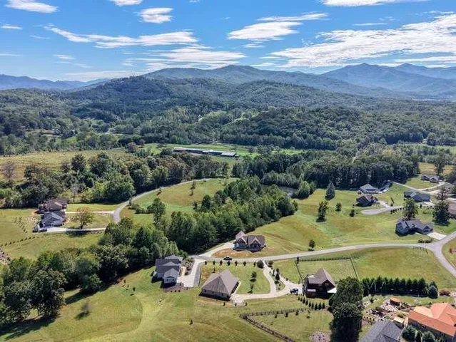 a aerial view of a house with a yard