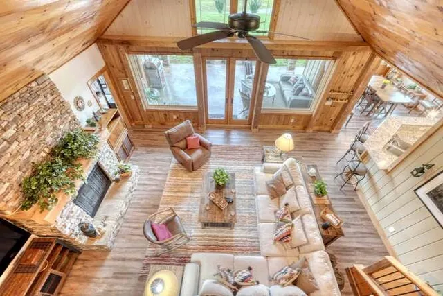 a view of a patio with couches table and chairs and potted plants