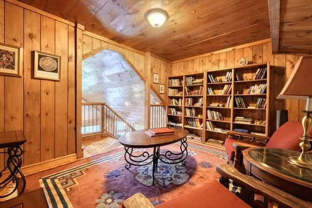 a view of a porch with furniture and a yard