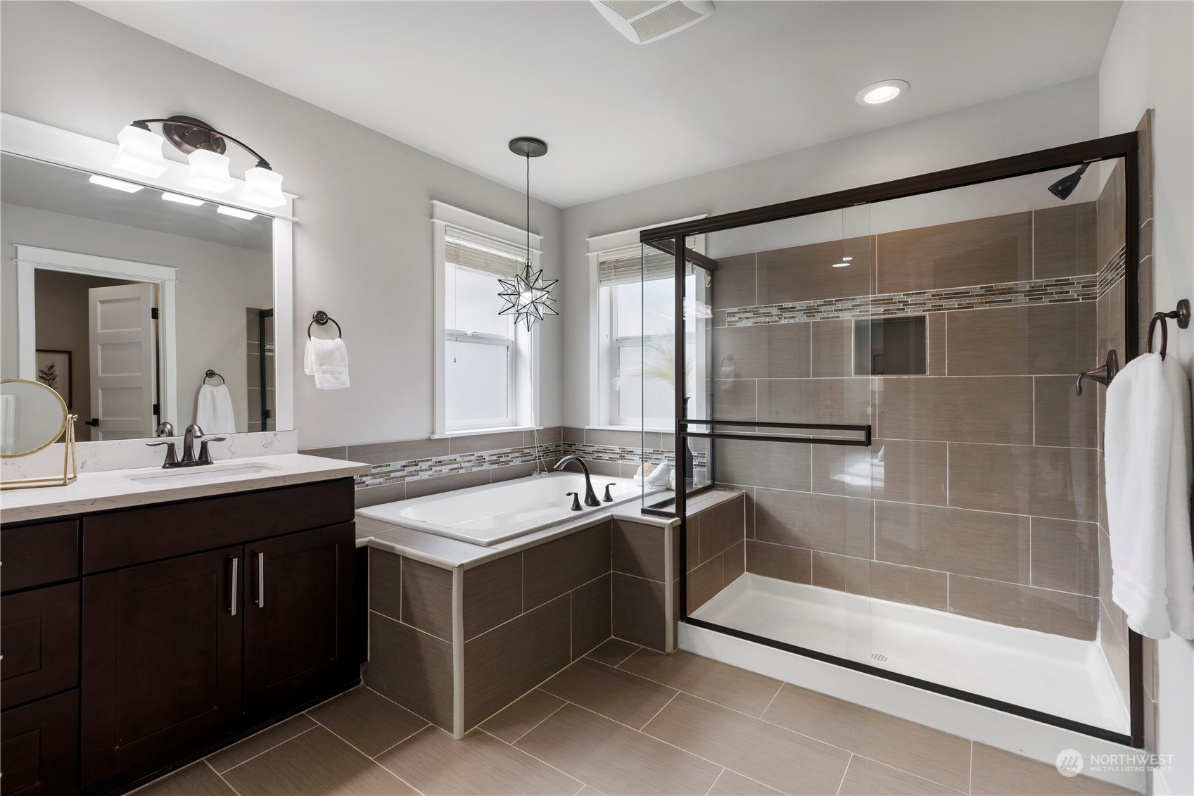 19730 Filbert Drive Bothell, WA 98012 - Photo 29 of 35 a bathroom with a granite countertop sink mirror and bathtub